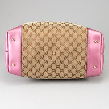GUCCI, a monogram canvas and pink metallic leather handbag.