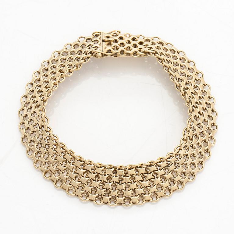 A 14K gold X-link bracelet, likely Norway.