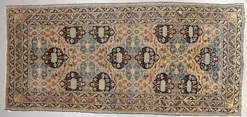 A carpet, semi-antique Kohrasan, ca 380 x 173 cm.