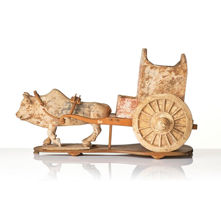 A pottery model of an ox with cart, Tang dynasty (618-907).
