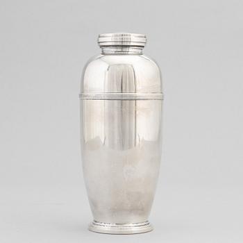 A silver plated shaker, C.G. Hallberg and a set of twelwe cocktail glasses, GAB, second half of the 20th Century.