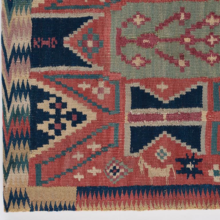 A CARRIAGE CUSHION, "Träd och timglas", double interlocked tapestry, ca 101,5 x 50,5 cm, Scania, Sweden,