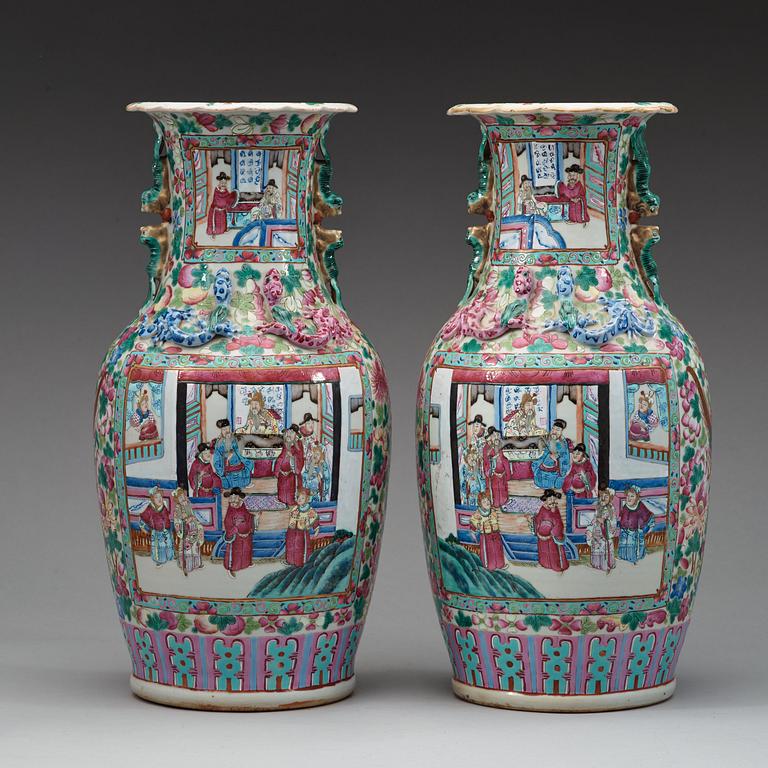 A pair of Canton famille rose vases, Qing dynasty, 19th Century.