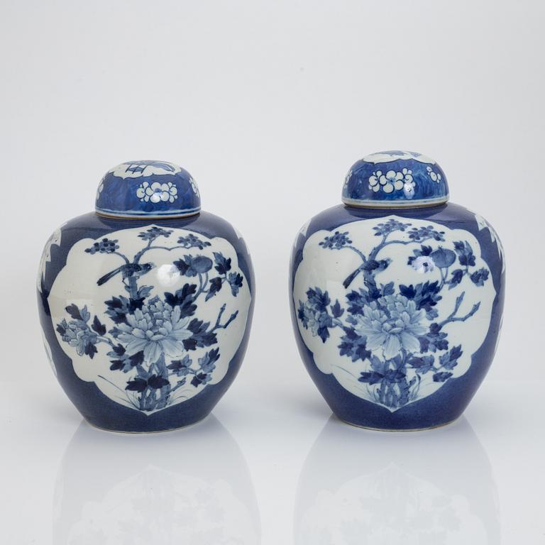 A pair of Chinese blue and white jars with covers, 20th century.