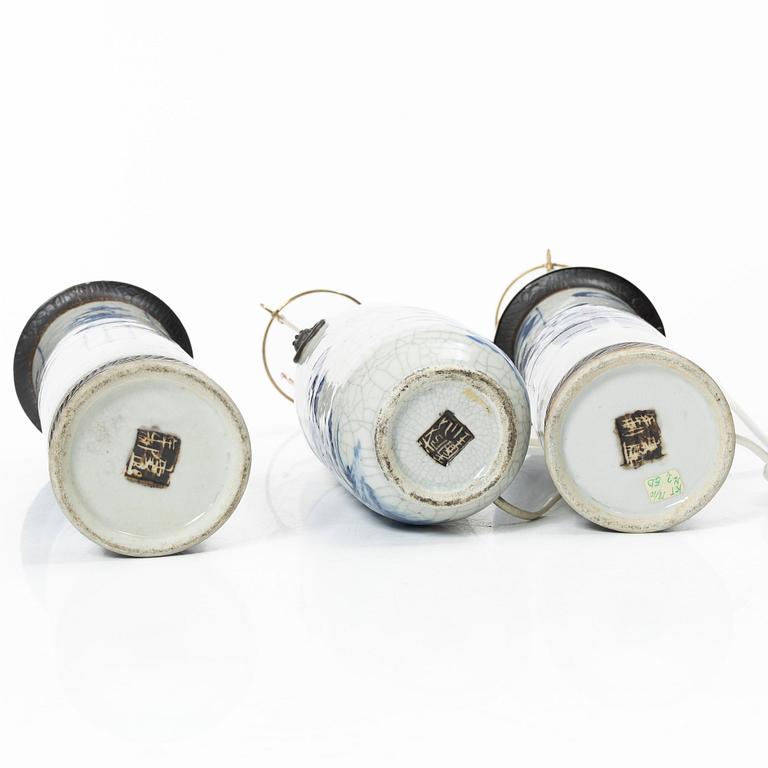 A group of three Chinese porcelain vases, two of them converted into table lamps, around 1900.