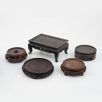 A group of nine hardwood stands, late Qing dynasty and 20th Century.