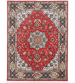 A figural Tabriz rug, part silk, 50 raj, signed, c. 202 x 152 cm.