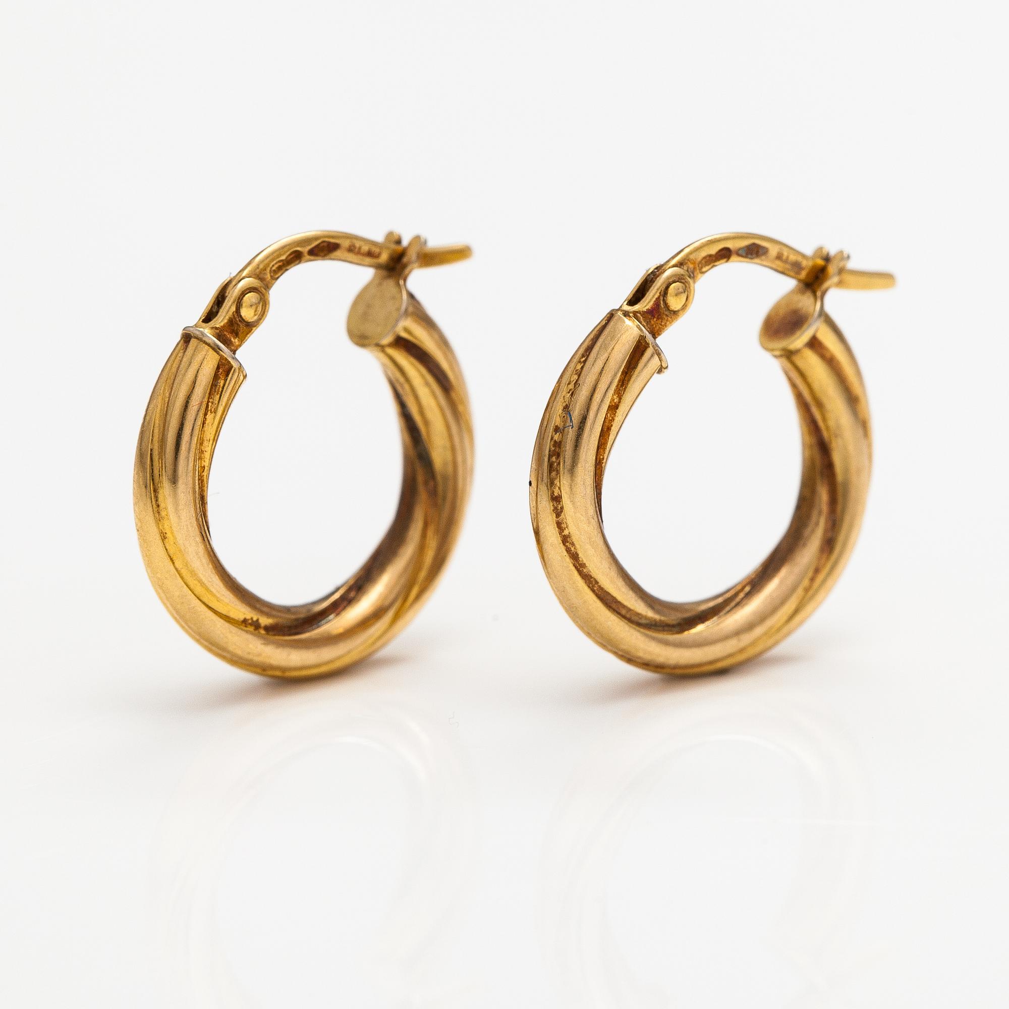 A pair of 14K gold earrings. Italy.