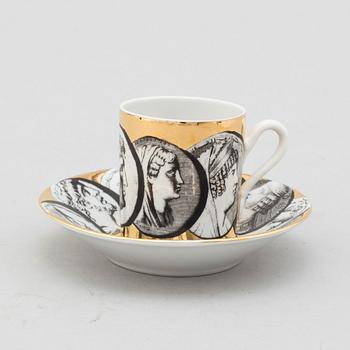 FORNASETTI, eight porcelian espresso cups and saucers from Milan, Italy.