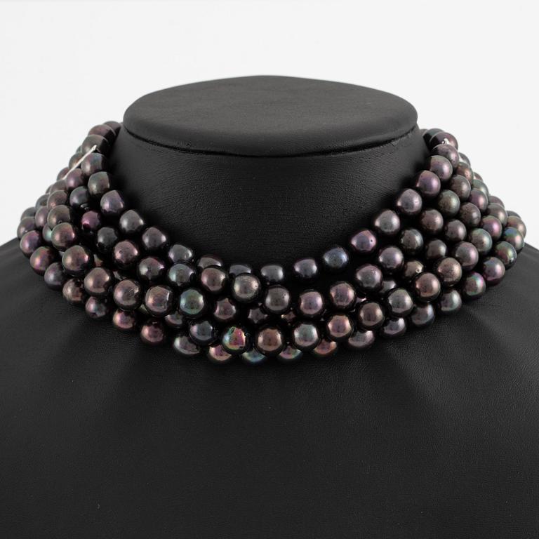Necklace, five-row with cultured black pearls, 18K gold and white gold with brilliant-cut diamonds.
