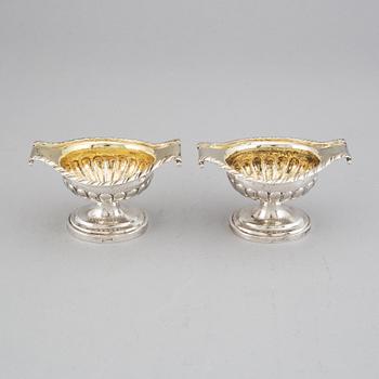 A pair of 19th century parcel-gilt silver salt-cellars, unidentified marks.