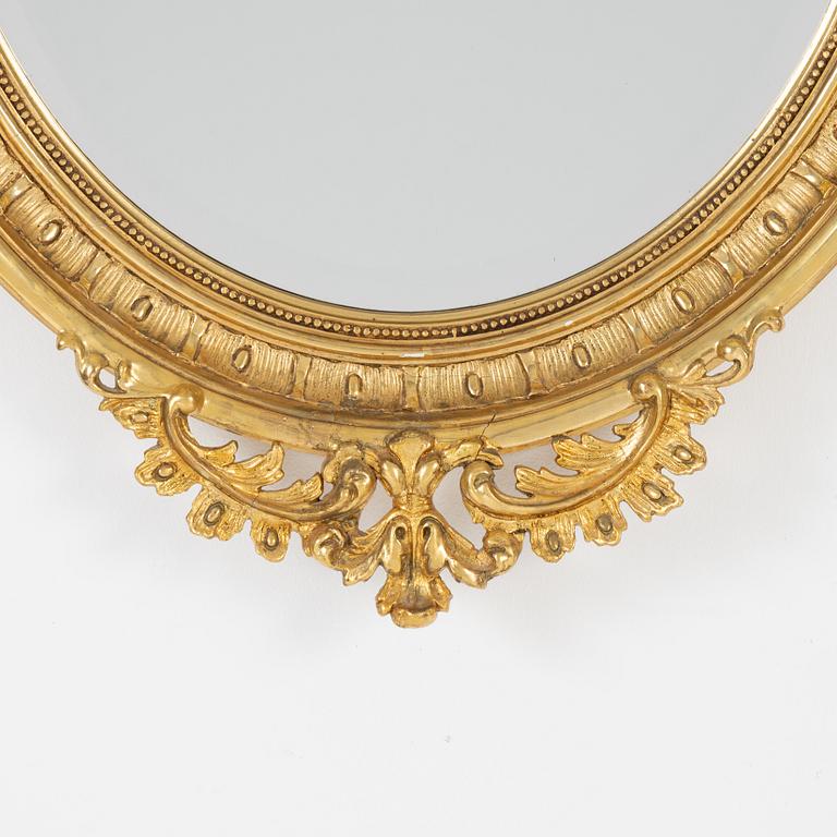 A Rococo style mirror, first half of the 20th Century.