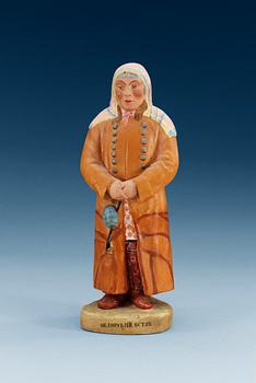 An unmarked Russian bisquit figure depicting a man from Obdorsk (Salekhard), first half of 20th Century.