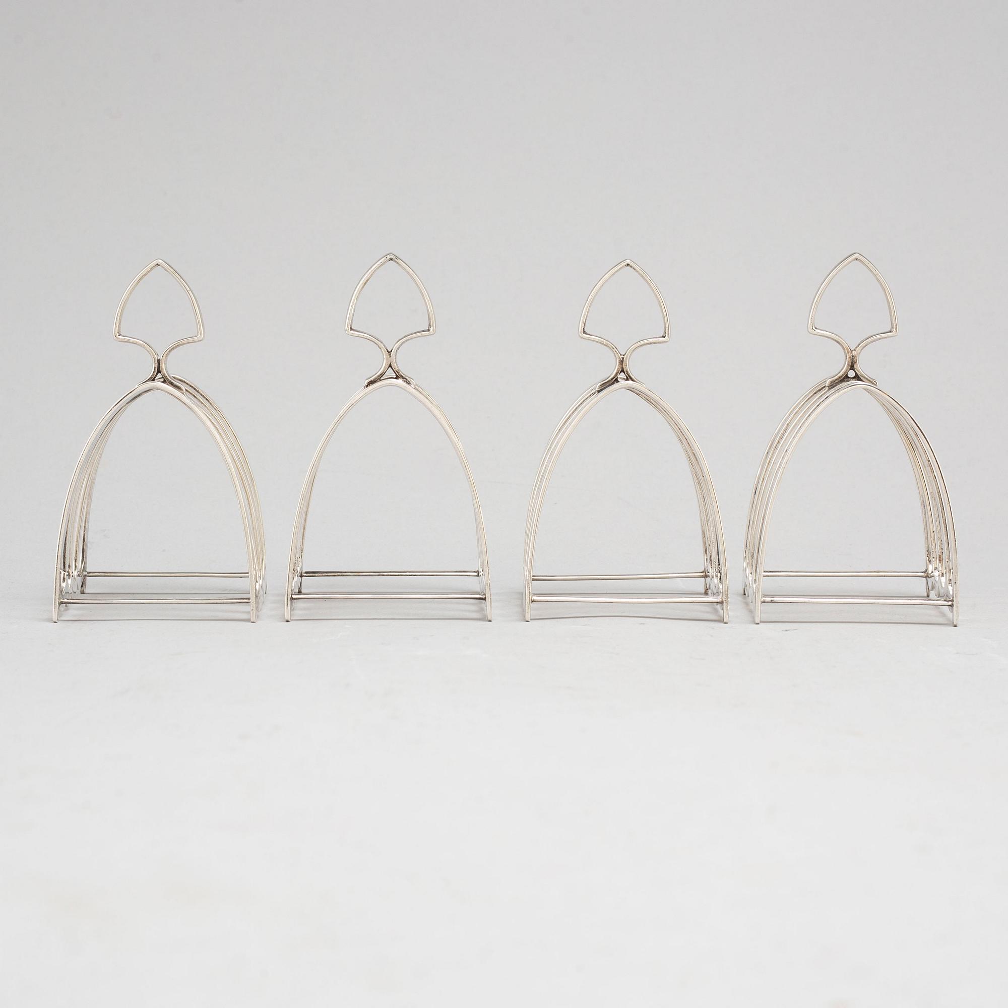 a set of four silver toastracks, Barker Brothers Birmingham 1936.