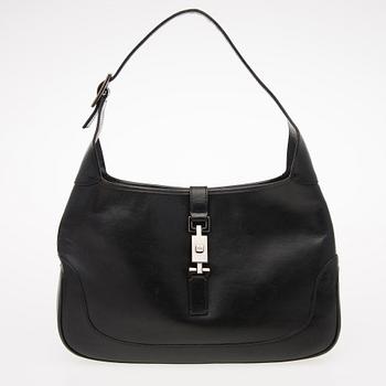 A Black Leather Jackie Bag.