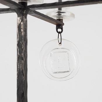 Erik Höglund, a iron and glass candelabra.