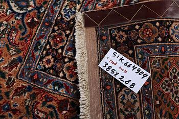 A carpet, Moud, signed, ca 385 x 268 cm.