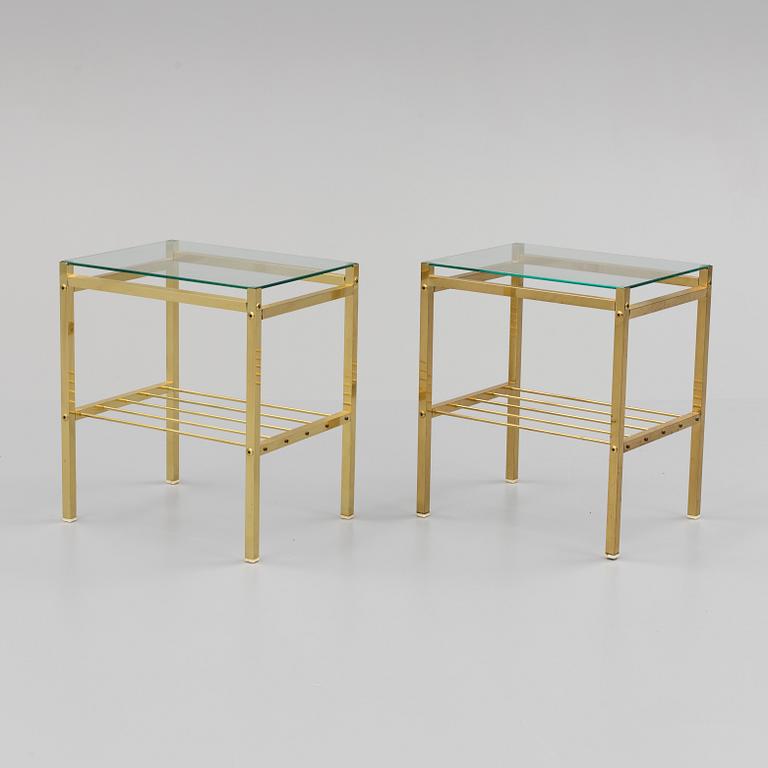 A pair of brass and glass tables, second half of the 20th century.
