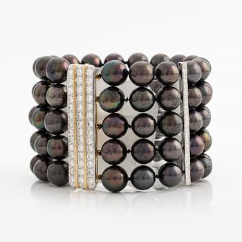 Bracelet and necklace, cultured black pearls, gold and white gold with brilliant-cut diamonds.