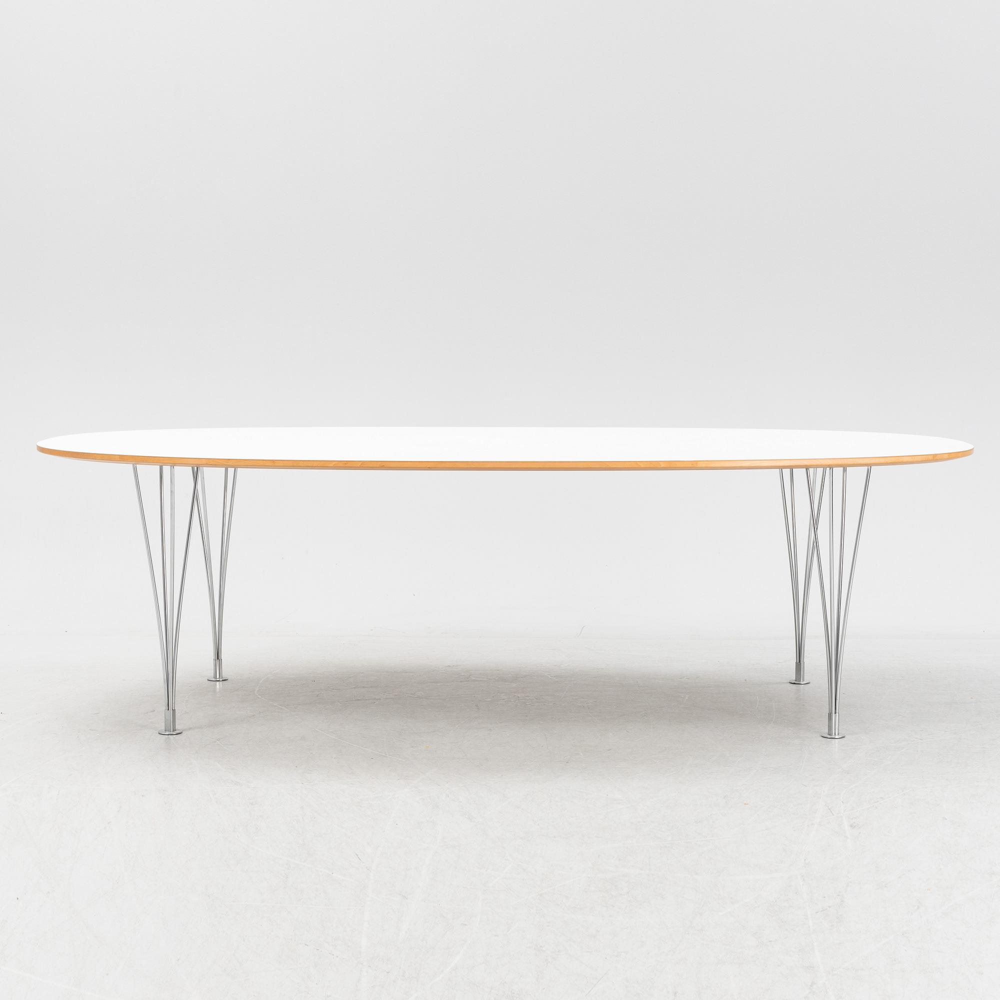 A Super ellpitical dining table, by Bruno Mathsson and Piet Hein for Fritz Hansen dated 2008.