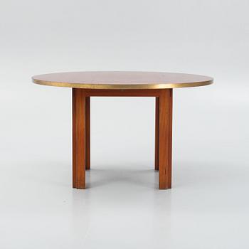 A mid 20th century dining table.