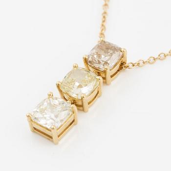 Pendant with chain in 18K gold set with a radiant-cut diamond and two cushion-cut diamonds.