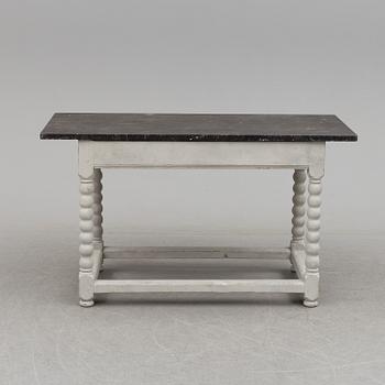 A 19/20th century stone top baroquestyle table.