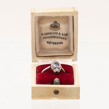 Art Deco platinum ring with an oval faceted sapphire and old-cut and rose-cut diamonds.