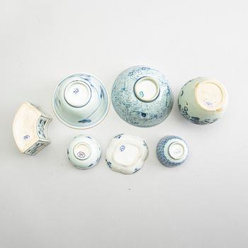 A group of seven blue and white porcelain pieces, some Ming dynasty (1368-1644).