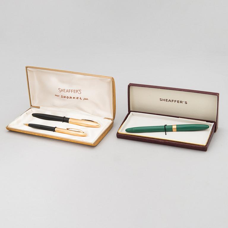 Sheaffer's, two reservoir pens and a pencil, 14K gold tips. USA, mid 20th-century.