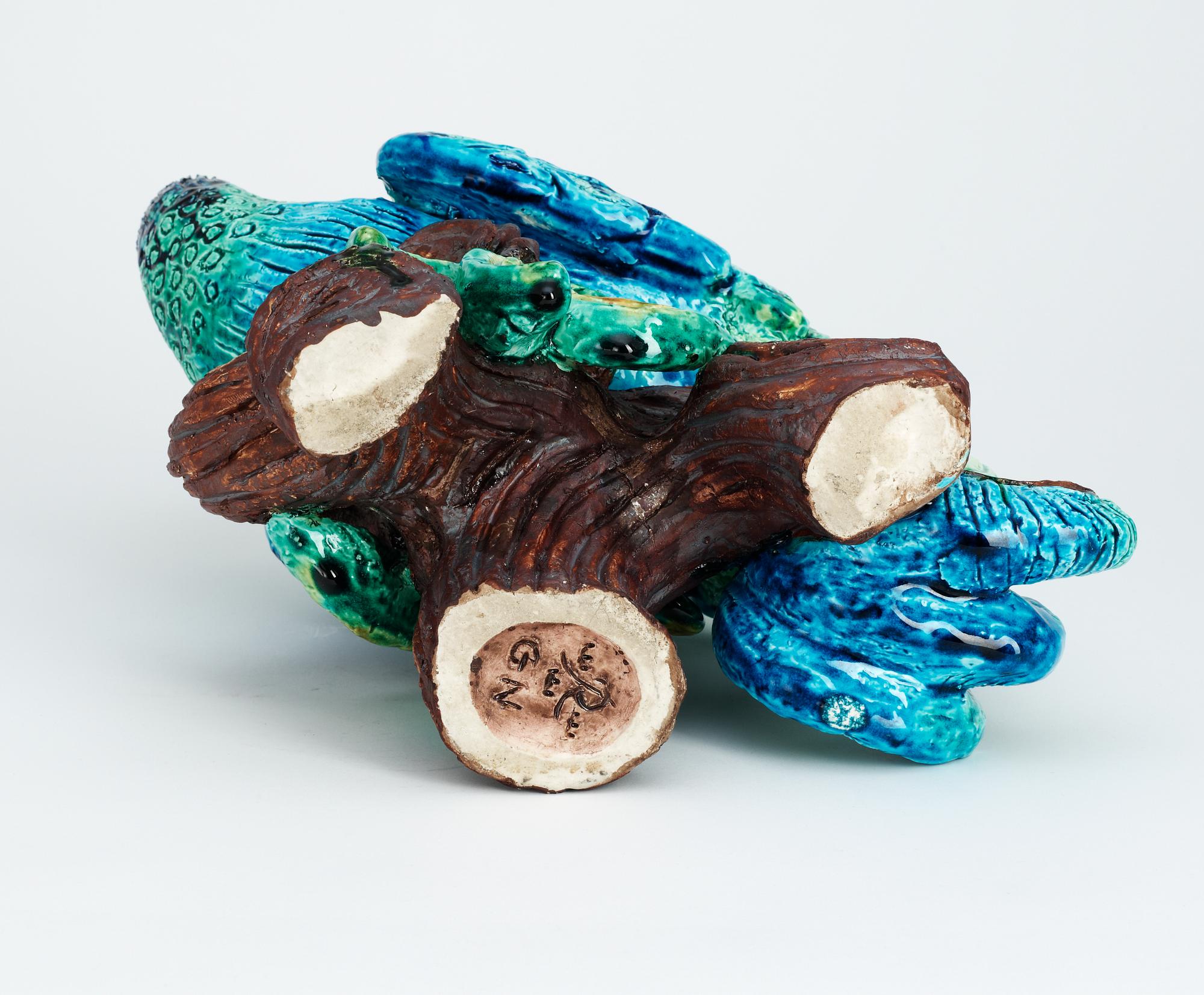 A Gunnar Nylund stoneware figure of a peacock.