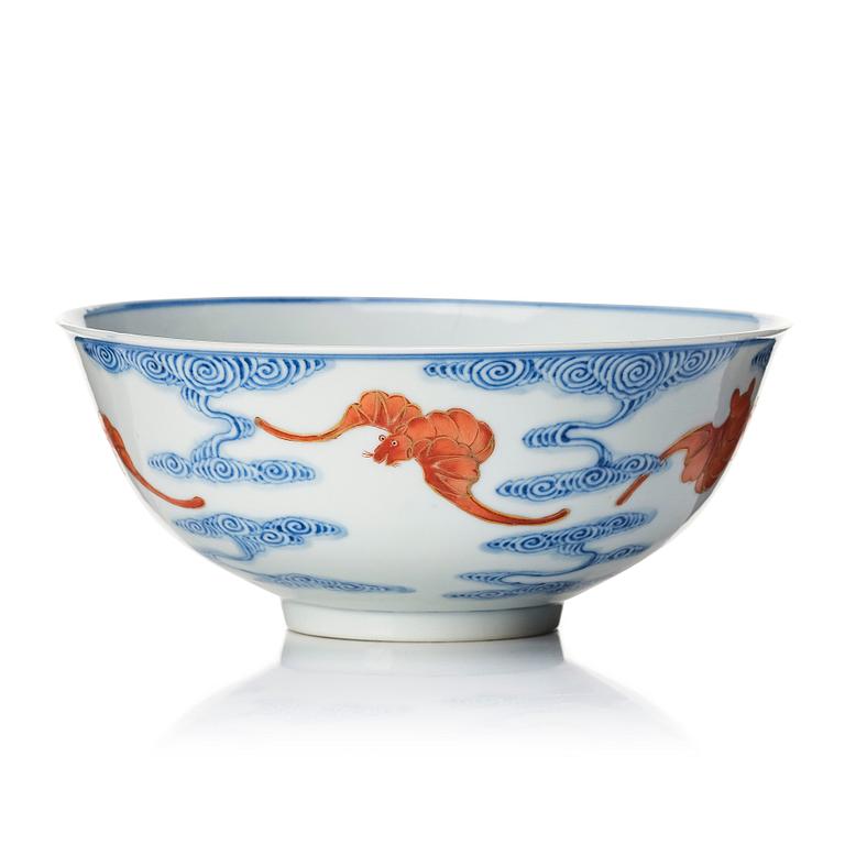 A Chinese iron-red-decorated blue and white Wufu bat bowl, late Qing dynasty, around 1900.