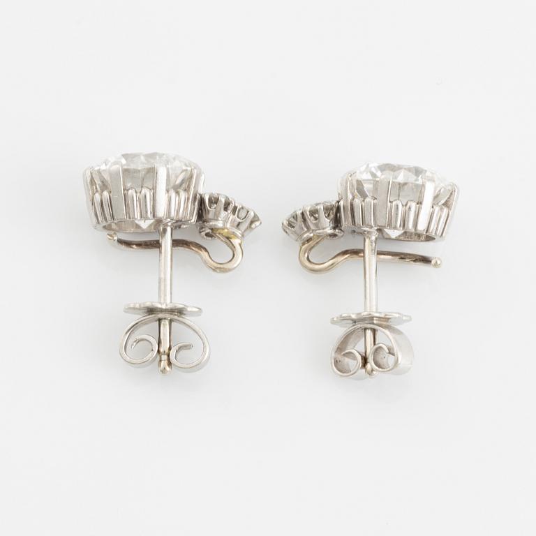 A pair of 18K white gold earrings set with two round brilliant-cut diamonds, probably made by WA Bolin.