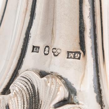 A pair of silver candelabra, maker's mark of Gustaf Möllenborg, Stockholm 1876.