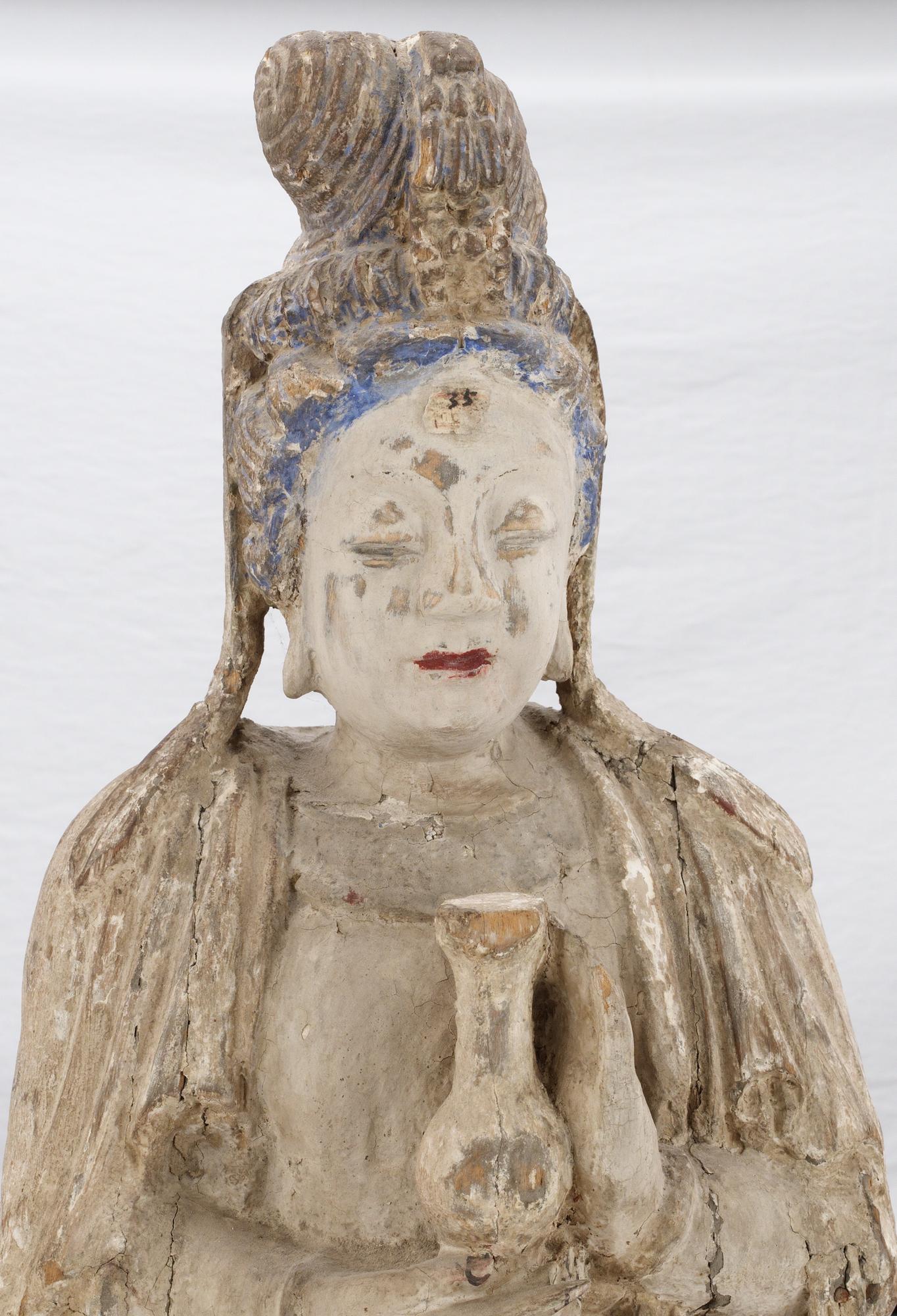 A wooden sculpture of Guanyin, Ming dynasty (1368-1644).