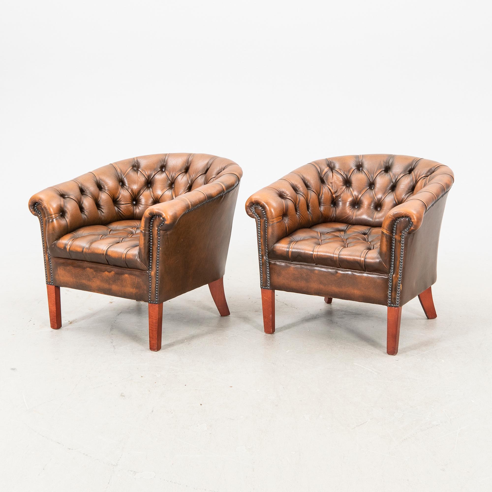 A pair of leather armchairs. second half of the 20th century.