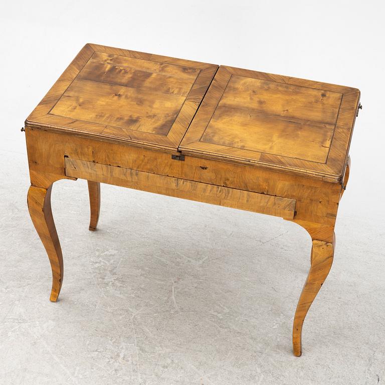 A Rococo card table, second half of the 18th Century.