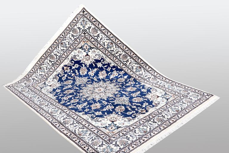 A rug, Nain, ca 210 x 122 cm.