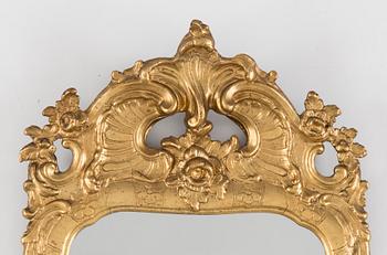 A Rococo mirror, 18th century.
