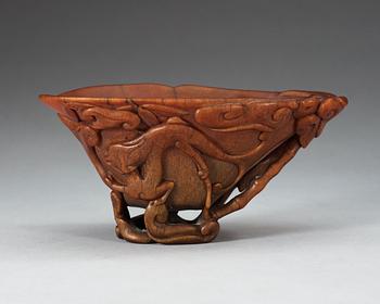 A finely carved rhinoceros libation cup, Qing dynasty, Kangxi (1662-1722).