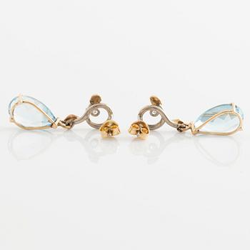 Earrings with pear-shaped topazes and brilliant-cut diamonds.