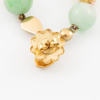 A pair of earrings in 18K gold with various coloured gemstones.