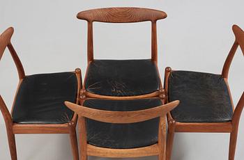 A Hans J Wegner oak dinner table 'AT 312' and four oak and black leather chairs, C M Madsen, Denmark 1950-60's.