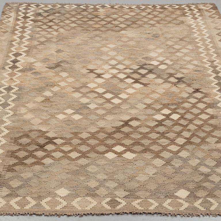 A carpet, kilim, around 254 x 160 cm.