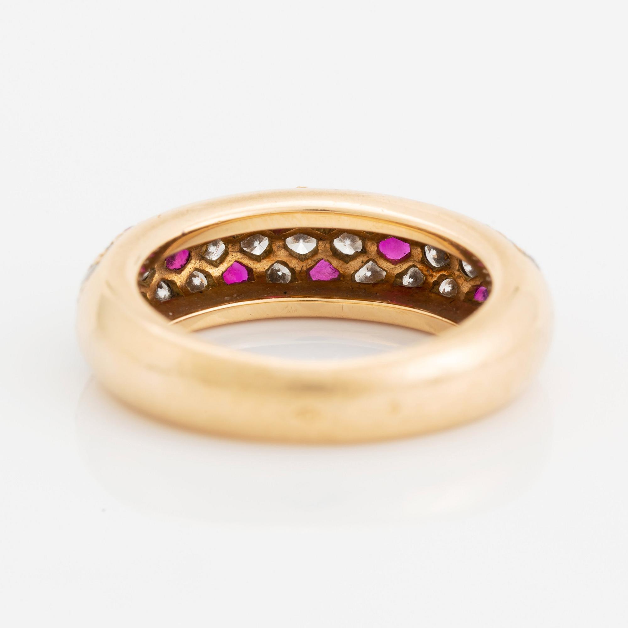 An 18K gold Cartier ring set with round brilliant-cut diamonds and rubies.