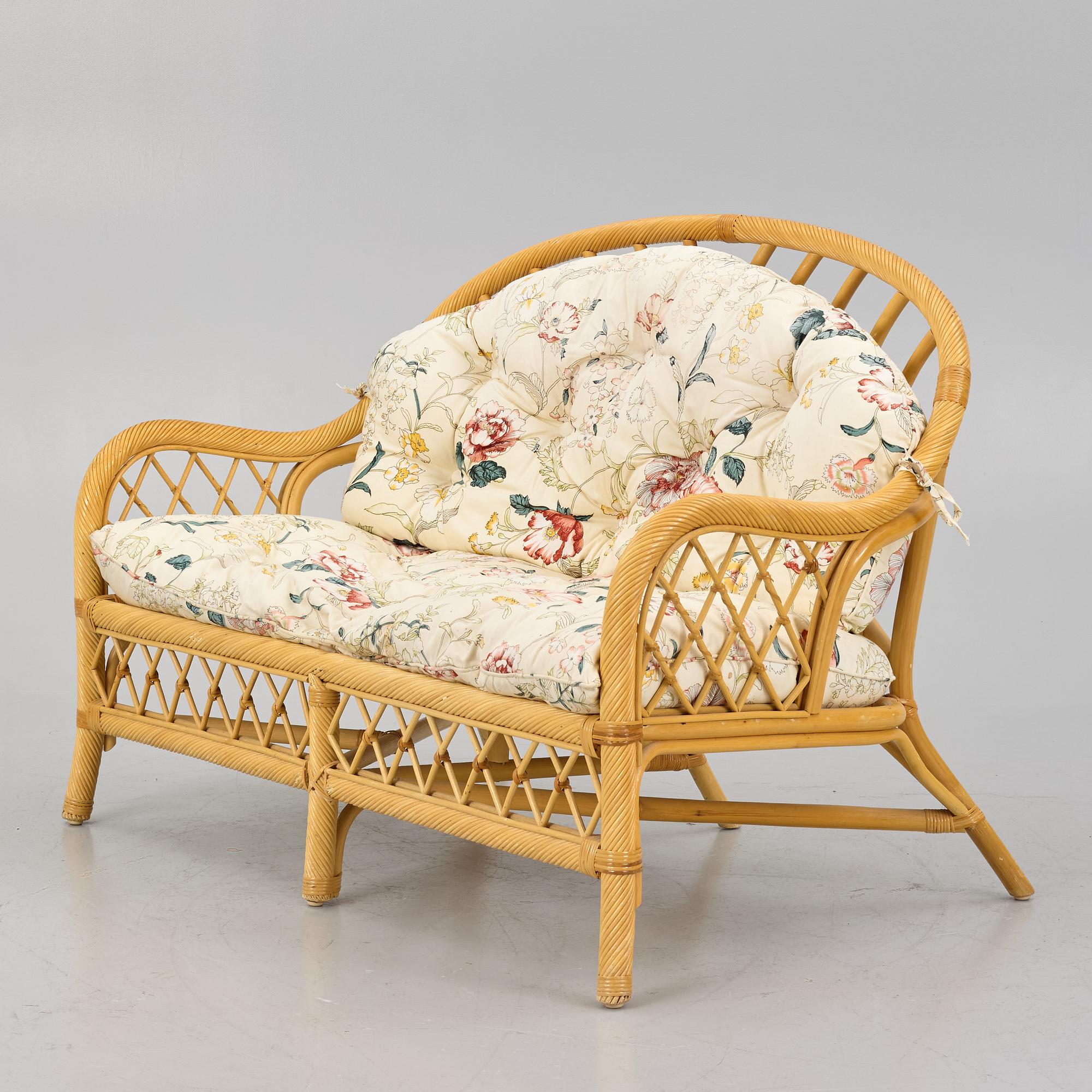 A rattan sofa and two armchairs, later part of the 20th century.