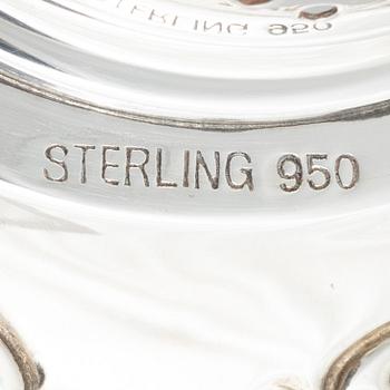 Two sterling silver tea strainers with stands, 20th century.