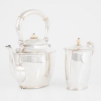 A silver teapot, mark of CG Hallberg, Stockholm 1919 and silver a milk jug, Edlunds silvervarufabrik, Stockholm 1937.