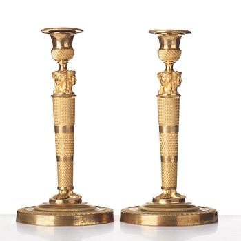 A pair of French Empire candlesticks, early 19th century.