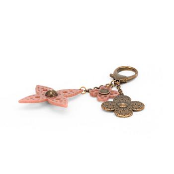 676. LOUIS VUITTON, a brass bag charm.